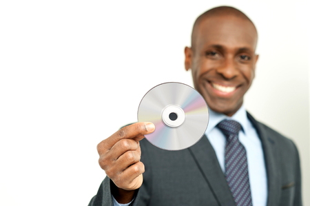 African businessman showing a blank compaq discの写真素材