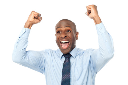 Excited african entrepreneur clenching his fistsの写真素材