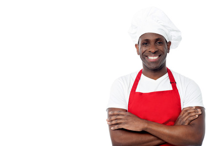 Confident middle aged chef with arms crossedの写真素材