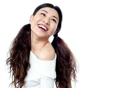 Fashion girl posing in style over whiteの写真素材