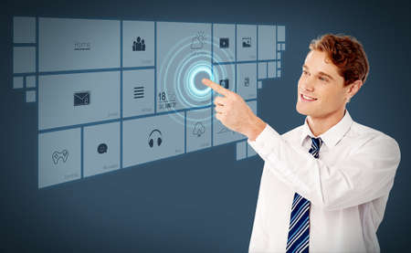 Young business man pointing on futuristic virtual screen