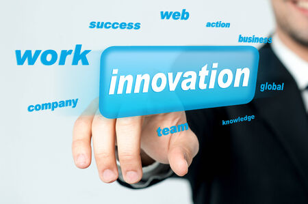 Businessman pressing innovation button on a touch screenの写真素材