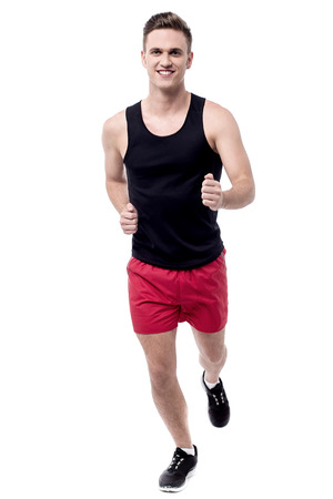 Full length images of male athlete runningの写真素材