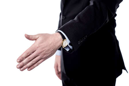 Cropped image of business man extending hand to shake