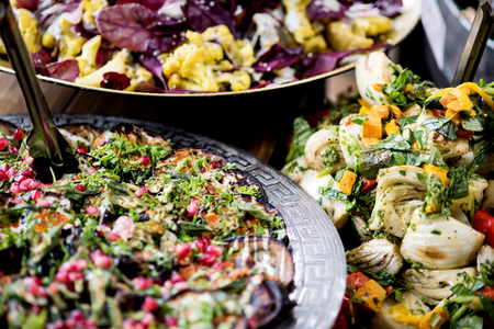 Close up image of assorted salads in buffet