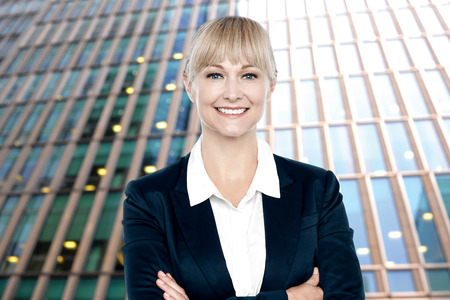 Middle aged female executive posing to the cameraの写真素材