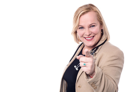 Senior female doctor pointing her finger at camera.の写真素材