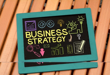 Business Strategy idea Drawing on Slate with iconsの写真素材