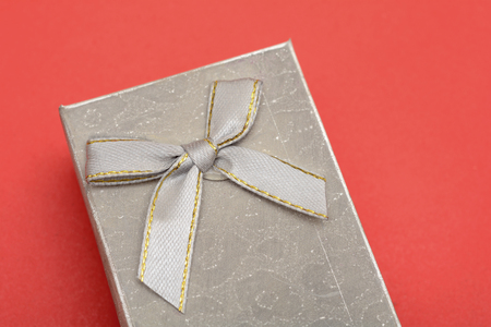 Silver gift box on red banner template with copyspaceの写真素材