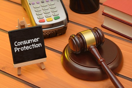 Consumer protection theme with wooden gavel on table, law backgroundの写真素材