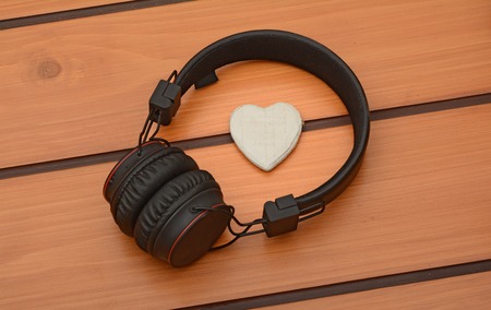 Headphone with heart icon on wooden Backgroundの写真素材