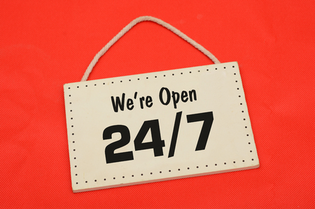 We are open sign on red cloth background