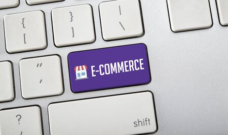 E-Commerce word on computer keyboard, online shopping concept