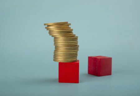 Coin Stack on red wooden block, income tax, property tax conceptの写真素材