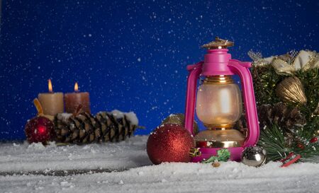 Christmas background with lalten, tree branches and snowの写真素材