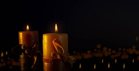 Burning candles of christmas on white background with copy space for your textの写真素材
