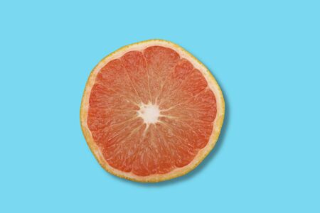 Close up photo of grapefruit on sea green background with copy space.の写真素材