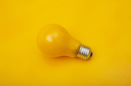 A close up of a yellow light with yellow background