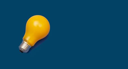 Ideas concept yellow painted blub on blue banner templateの写真素材