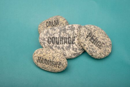 Text of calm, courage, harmony, peace on stone concept of meditationの写真素材