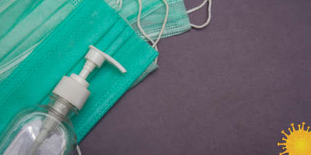 Banner template with hand sanitizer and face masks on the leftの写真素材