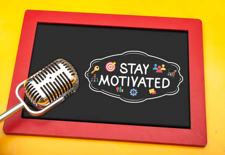Stay motivated sign with micorphone conceptual photo for motivational speakerの写真素材