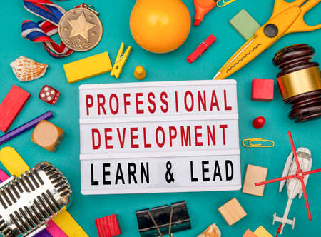 Professional development sign with office stationery top view.