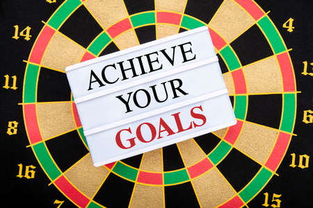 Achieve your goals wrritten on dartboard sign - business concept.の写真素材