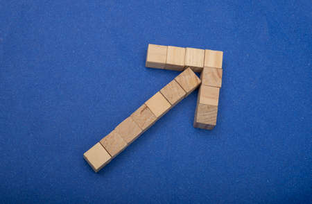 Wooden arrow upwards created as a business concept.
