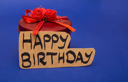 Hand written happy birthday wish card with red gift box.の写真素材