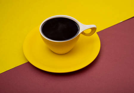 Yellow tea cup on multi color banner background.の写真素材