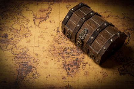 Secret treasure box with vintage world map - treasure hunt concept.の写真素材