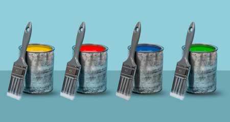 Multiple colors of emulsion paint tins with new brushes. Home decorative banner concept.の写真素材