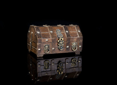 Secret wood box on black background refection making a success concept.の写真素材