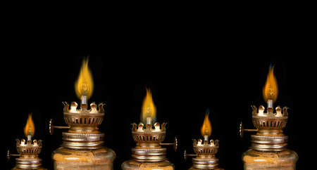 Vintage lantern burning on clear black banner template.の写真素材