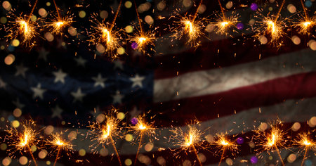 Sparkles with blurred United States of America flag in background - celebration concept.
