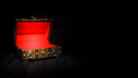 Old and antique wooden treasure box open with copy space.の写真素材
