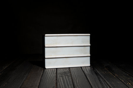 Empty Message board on black wooden table with space for your message.