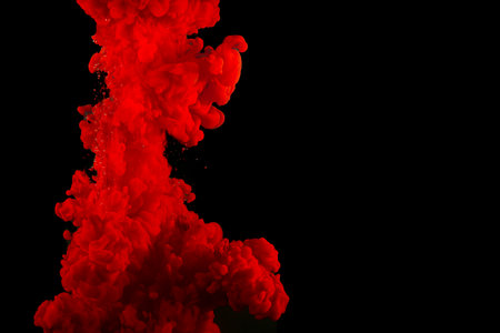 Red Acrylic ink makes abstract background with water splash.
