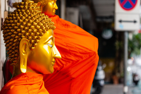 Buddhist statues on street; Thailandの写真素材