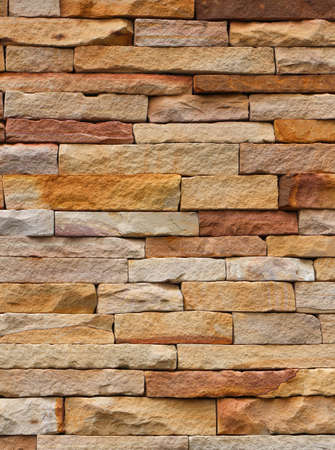Rectangular cut stone wall texture background.