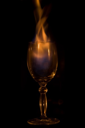Fire in glass on  black backgroundの写真素材
