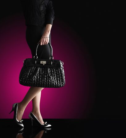 fashionable woman with a black bag, fashion photoの写真素材