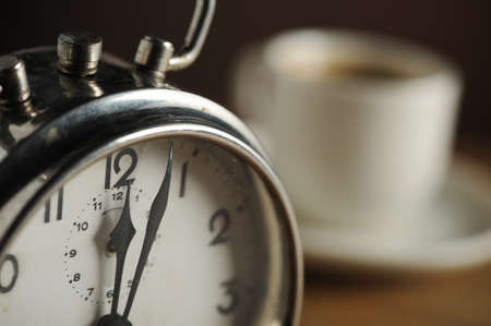 Alarm clock and coffee cup 