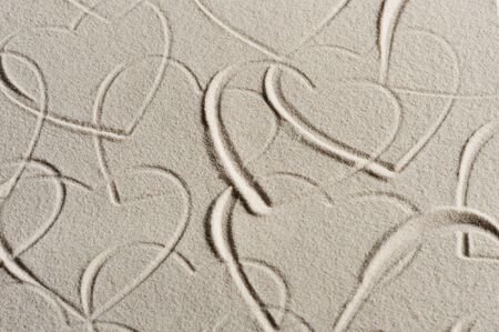 Beach background with hearts drawingの写真素材