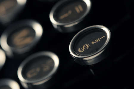 Close up photo of antique typewriter keys, shallow focus on dollar symbolの写真素材