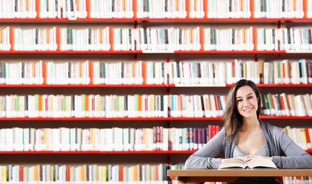 Portrait of a student  girl studying at libraryの写真素材