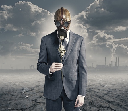 businessman with dried rose: concept polluted environmentの写真素材