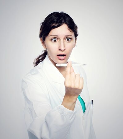 high fever: women doctor, being scared の写真素材
