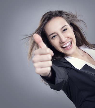 Businesswoman showing thumbs up signの写真素材